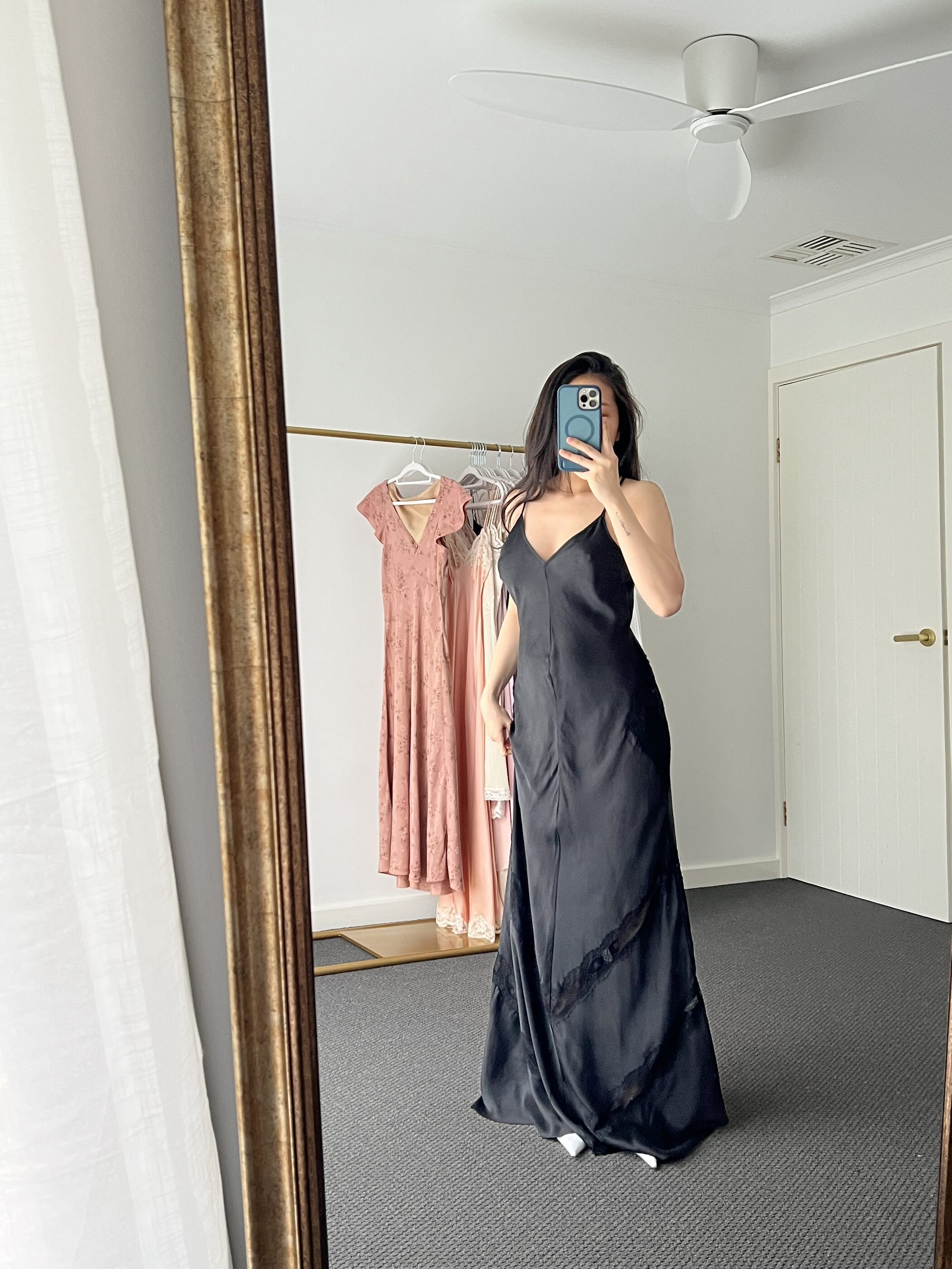 The black gown turned a little, with lace panels at the hip