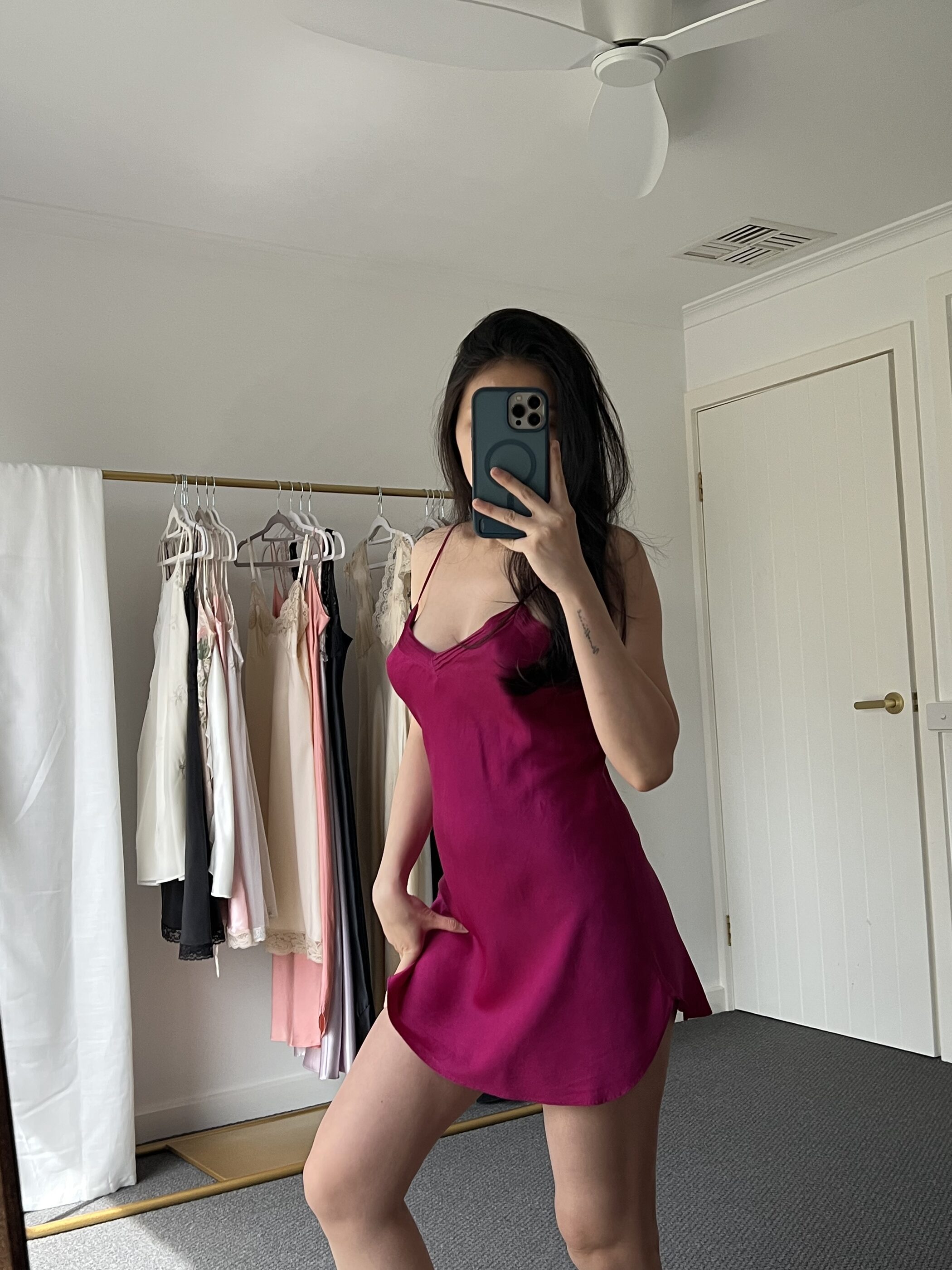 The berry slip from the side, showing the curved hem